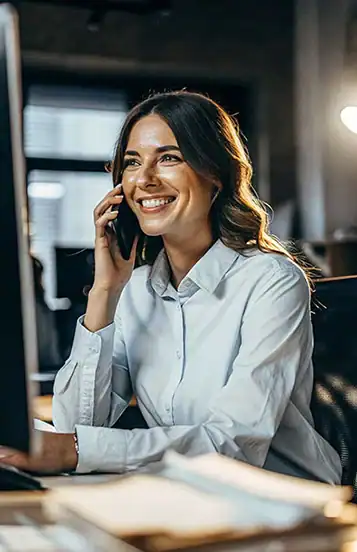 Happy female accountant on the phone