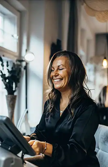 Lady about to take payment for a service