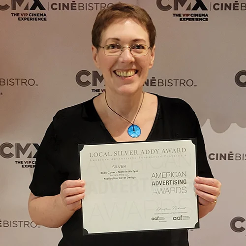Karen holding the American Marketing Award she just won